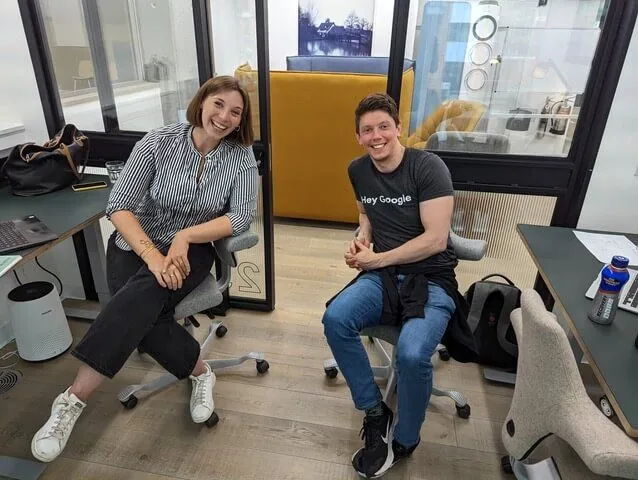 Two Starla team members working at their desks